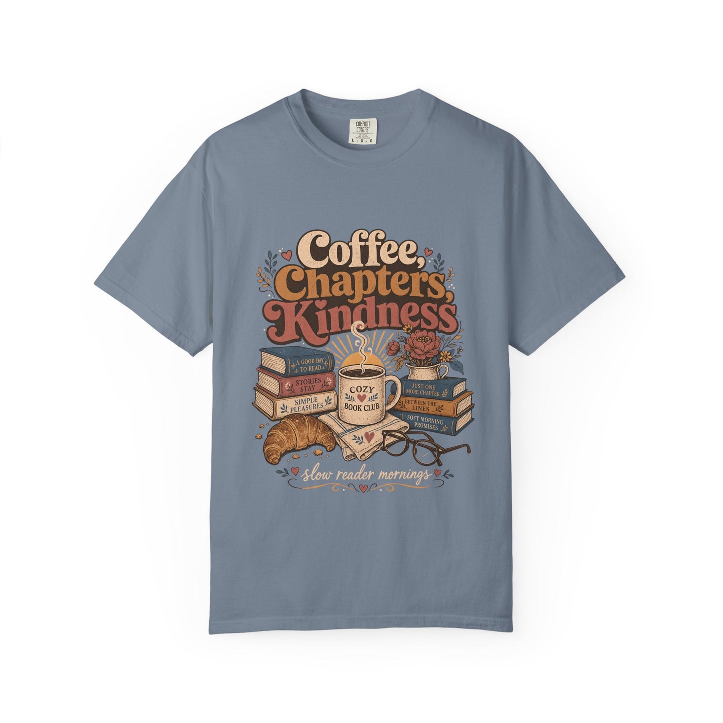 Coffee, Chapters, Kindness cozy reader T-shirt with coffee, books and croissant design on Blue Jean.