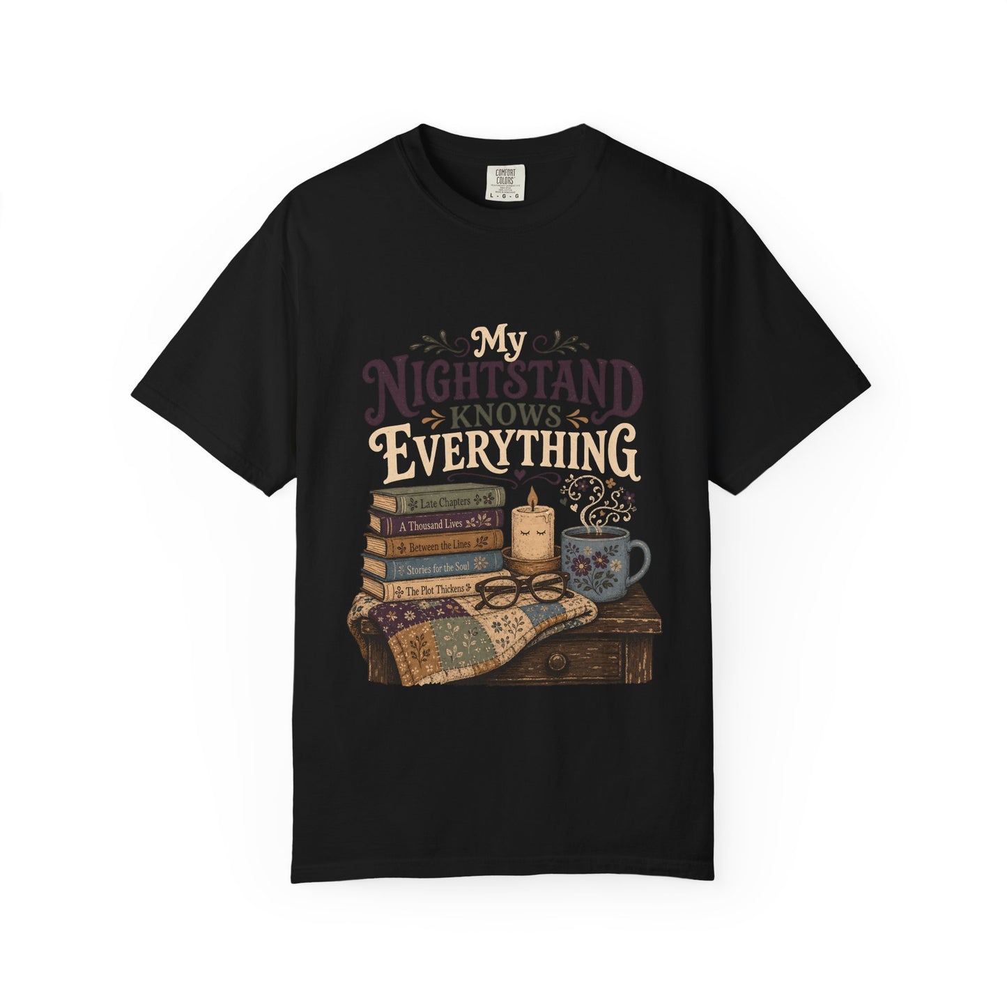 Front view of the My Nightstand Knows Everything Book Lover T-Shirt in Black featuring a vintage literary illustration with books, candle and mug.