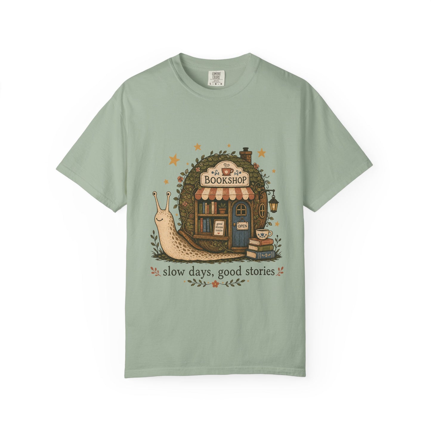 Slow Days, Good Stories Book Lover Shirt on a Bay Comfort Colors 1717 T-shirt featuring a woodland-inspired bookshop graphic.

