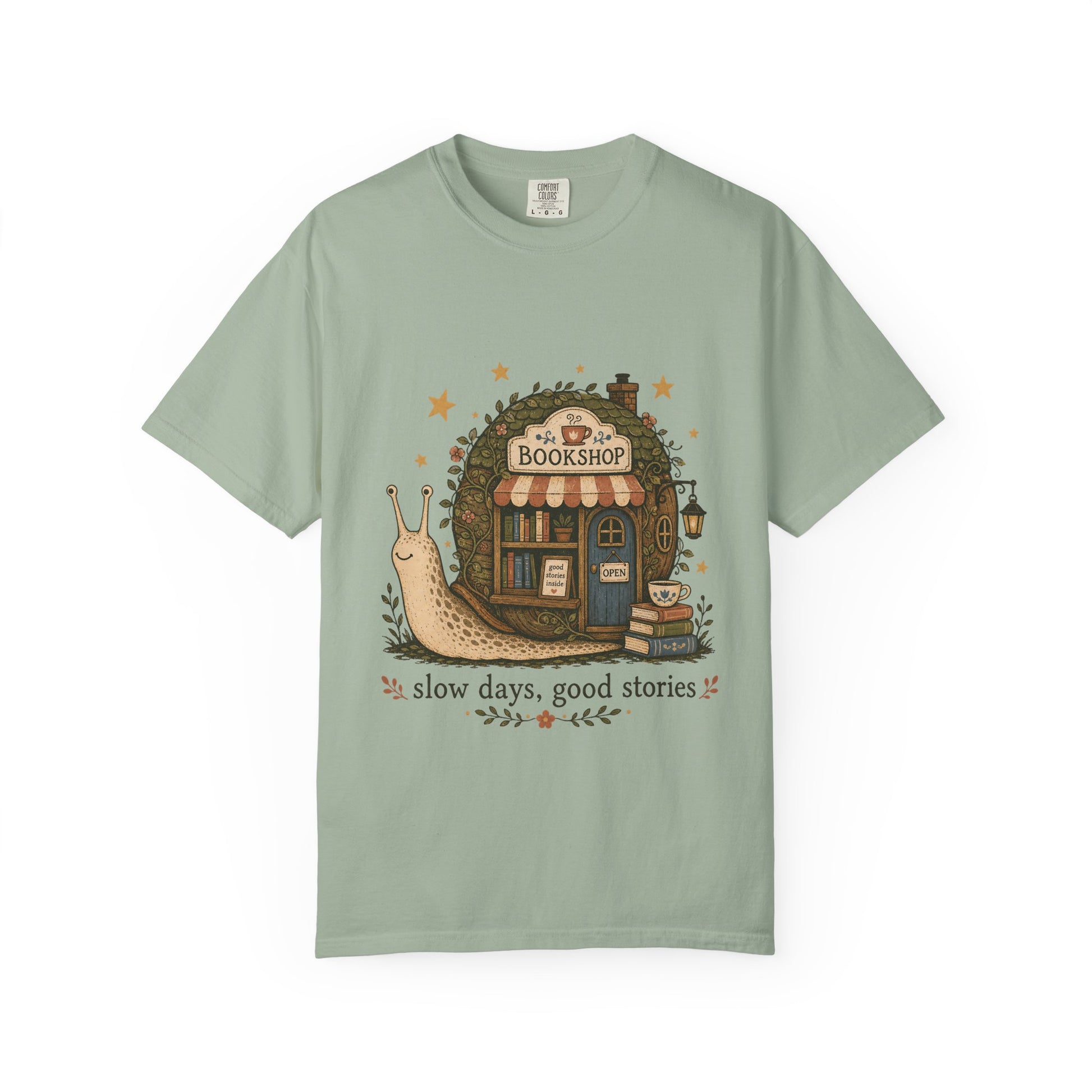 Slow Days, Good Stories Book Lover Shirt on a Bay Comfort Colors 1717 T-shirt featuring a woodland-inspired bookshop graphic.

