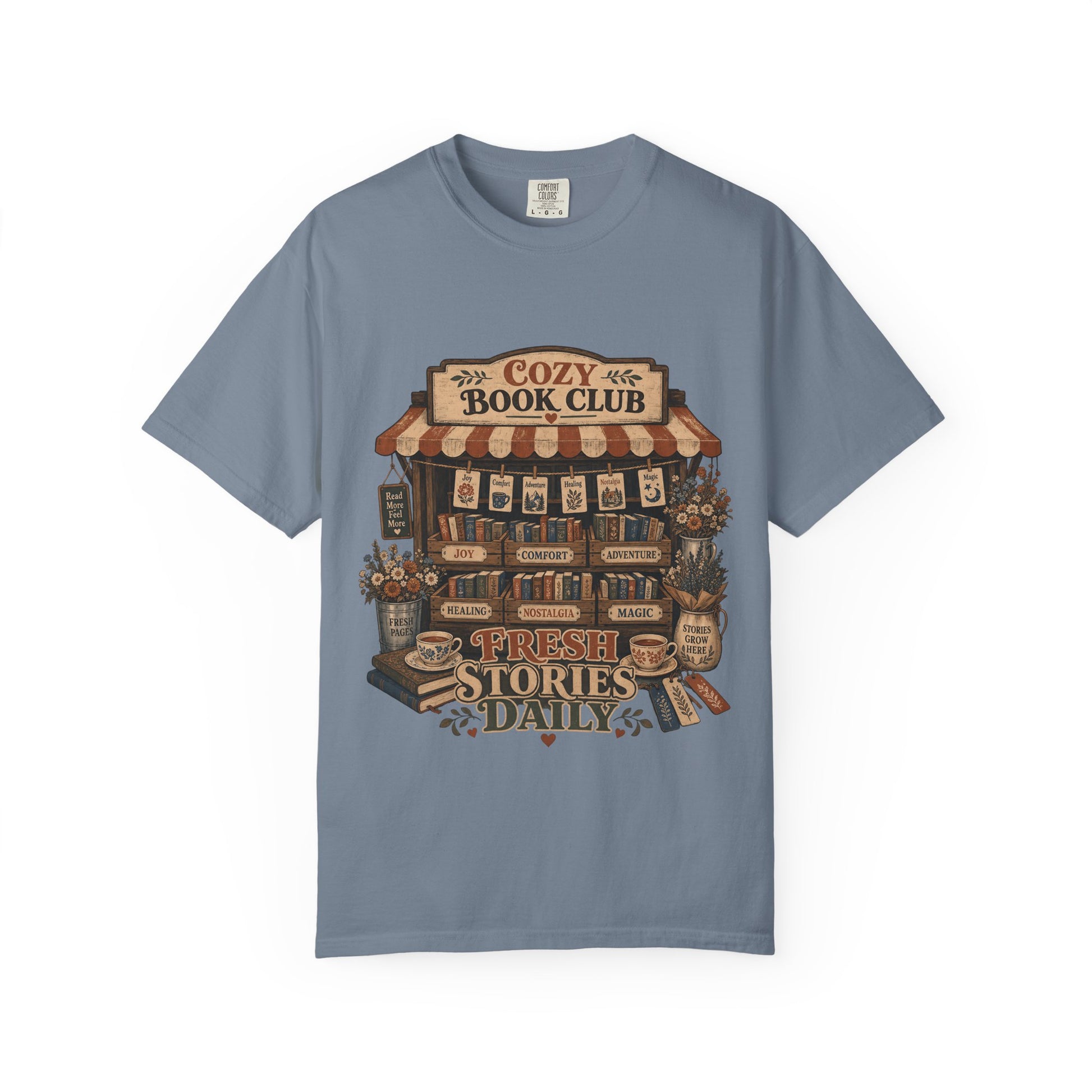 Fresh Stories Daily book club T-shirt in Blue Jean featuring a vintage bookstall filled with books, flowers and reading themes