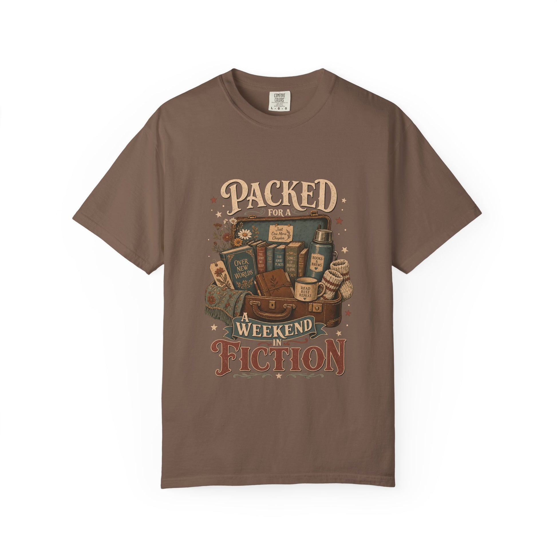 Packed for a Weekend in Fiction reading T-shirt in Espresso featuring a vintage suitcase packed with books, a mug, thermos and cozy socks