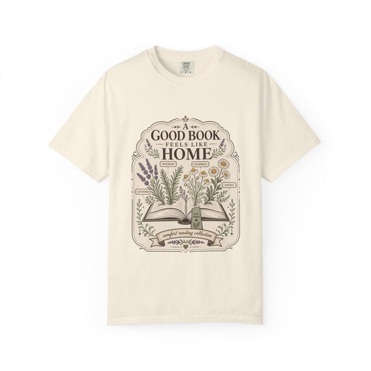 A Good Book Feels Like Home book lover T-shirt with open book, lavender, rosemary, chamomile and daisy botanical design on Ivory.