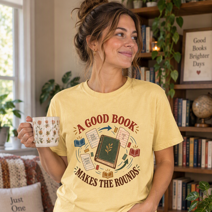 Book lover T-shirt featuring “A Good Book Makes the Rounds” with a book, arrows and sharing notes