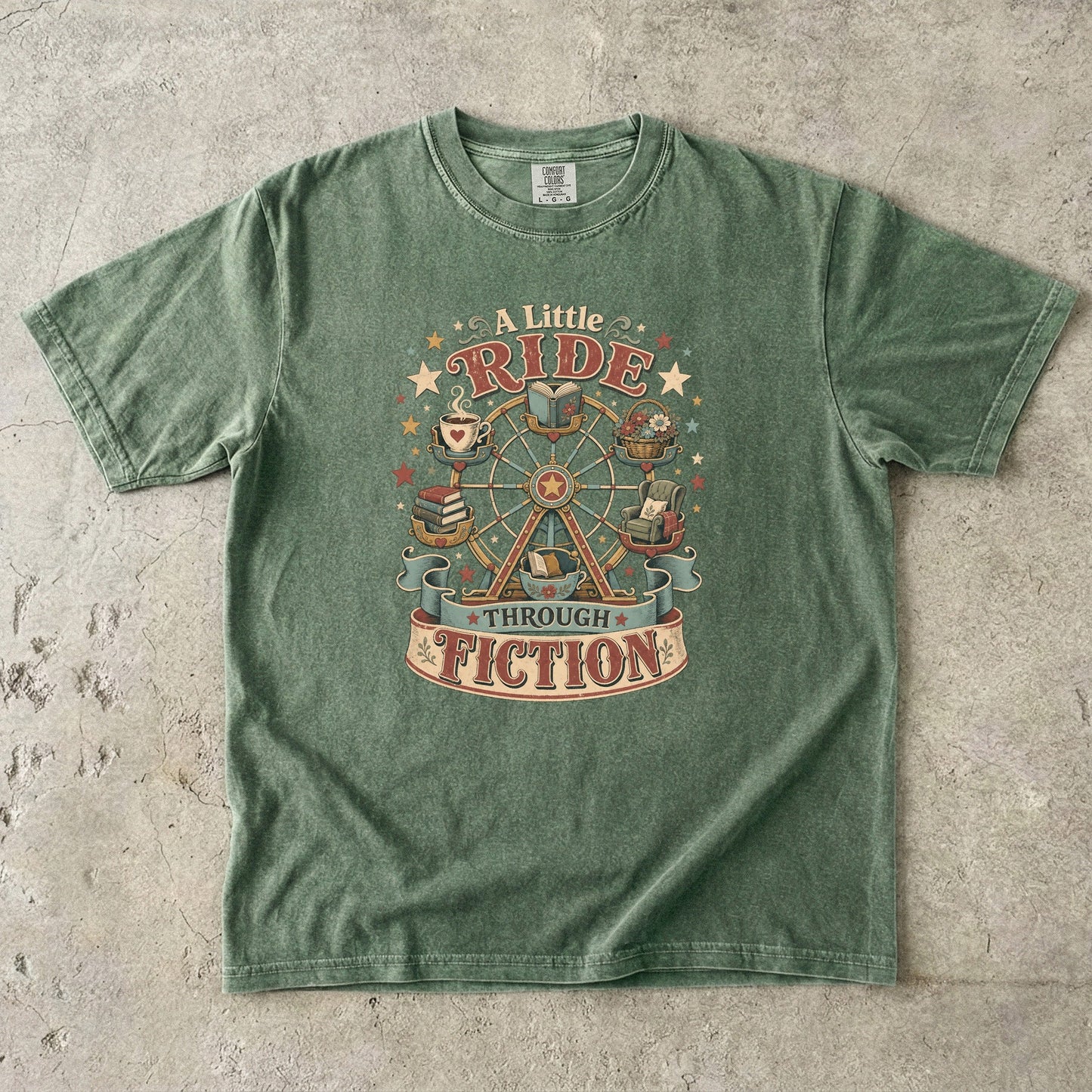 Front view of a Moss Comfort Colors book lover T-shirt featuring the "A Little Ride Through Fiction" design with books, tea, flowers and a whimsical Ferris wheel.
