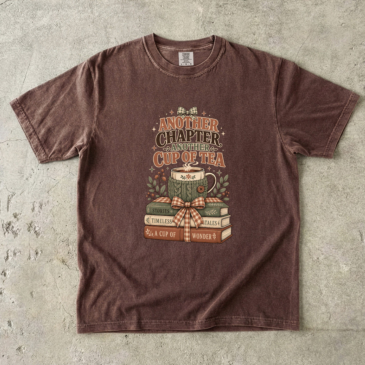 Another Chapter Another Cup of Tea reading shirt in Espresso with a steaming floral teacup and stack of vintage books.