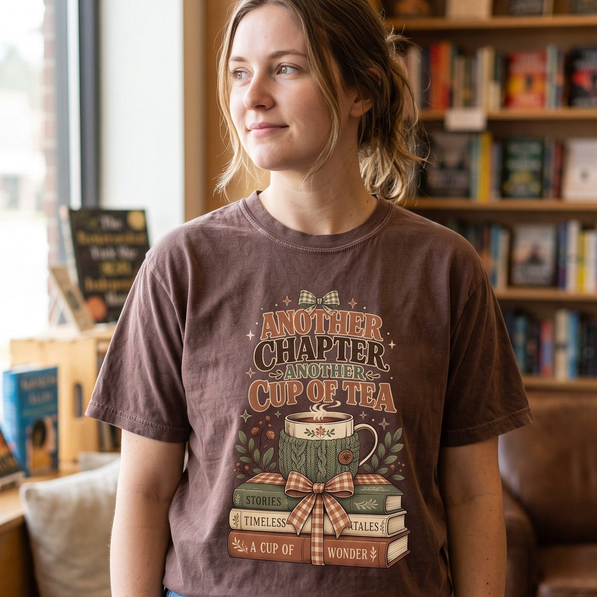 Another Chapter Another Cup of Tea reading shirt in Moss styled in a cozy books and tea lifestyle setting.