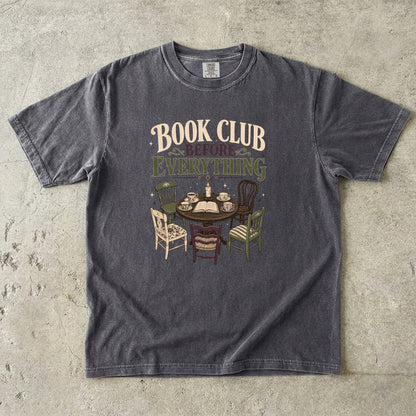 Pepper book club T-shirt featuring Book Club Before Everything with a vintage table, open book, teacups, candle and mismatched chairs.