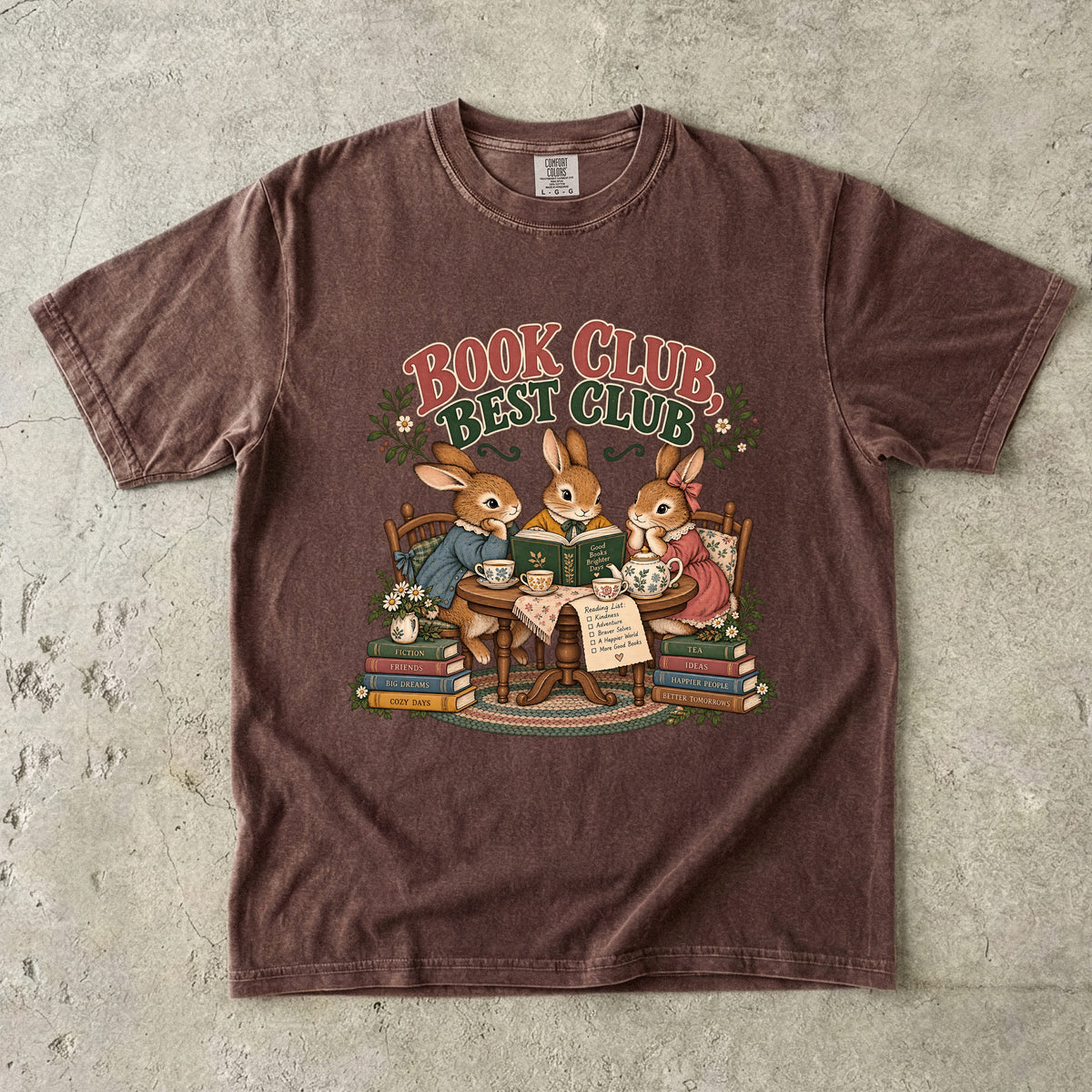 Espresso T-shirt featuring “Book Club, Best Club” with three rabbits reading together at a tea table, floral china, books and daisies.