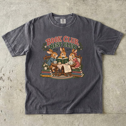 Pepper T-shirt featuring “Book Club, Best Club” with three rabbits reading together at a tea table, floral china, books and daisies.