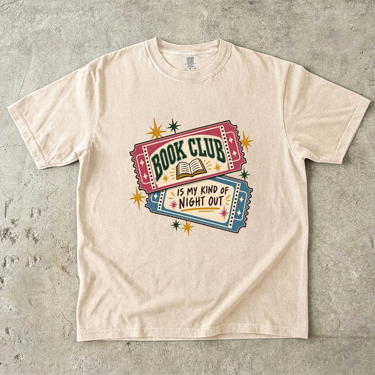 Ivory book club T-shirt with “Book Club Is My Kind of Night Out” on two illustrated tickets