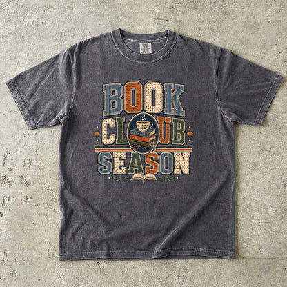 Pepper Comfort Colors Book Club Season T-shirt featuring bold vintage lettering, stacked books and a teacup.