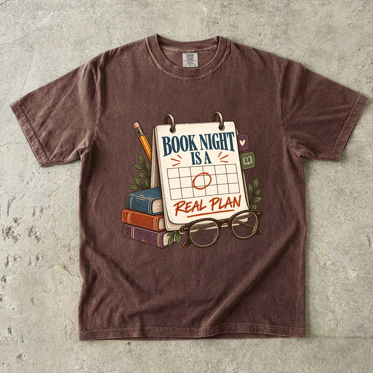 Espresso reading T-shirt with “Book Night Is a Real Plan” on a marked calendar beside books and glasses