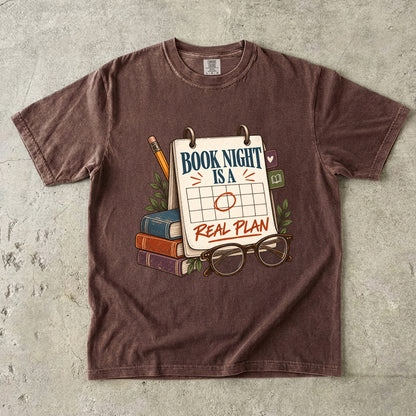 Espresso reading T-shirt with “Book Night Is a Real Plan” on a marked calendar beside books and glasses