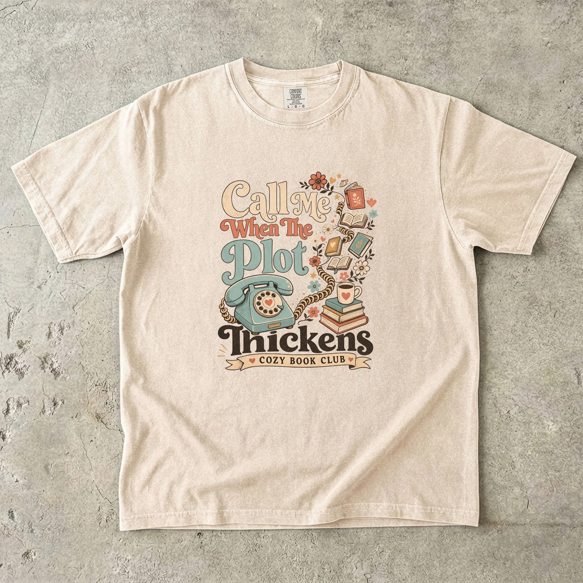 Call Me When the Plot Thickens book club T-shirt in Ivory featuring a vintage rotary phone, books and flowers