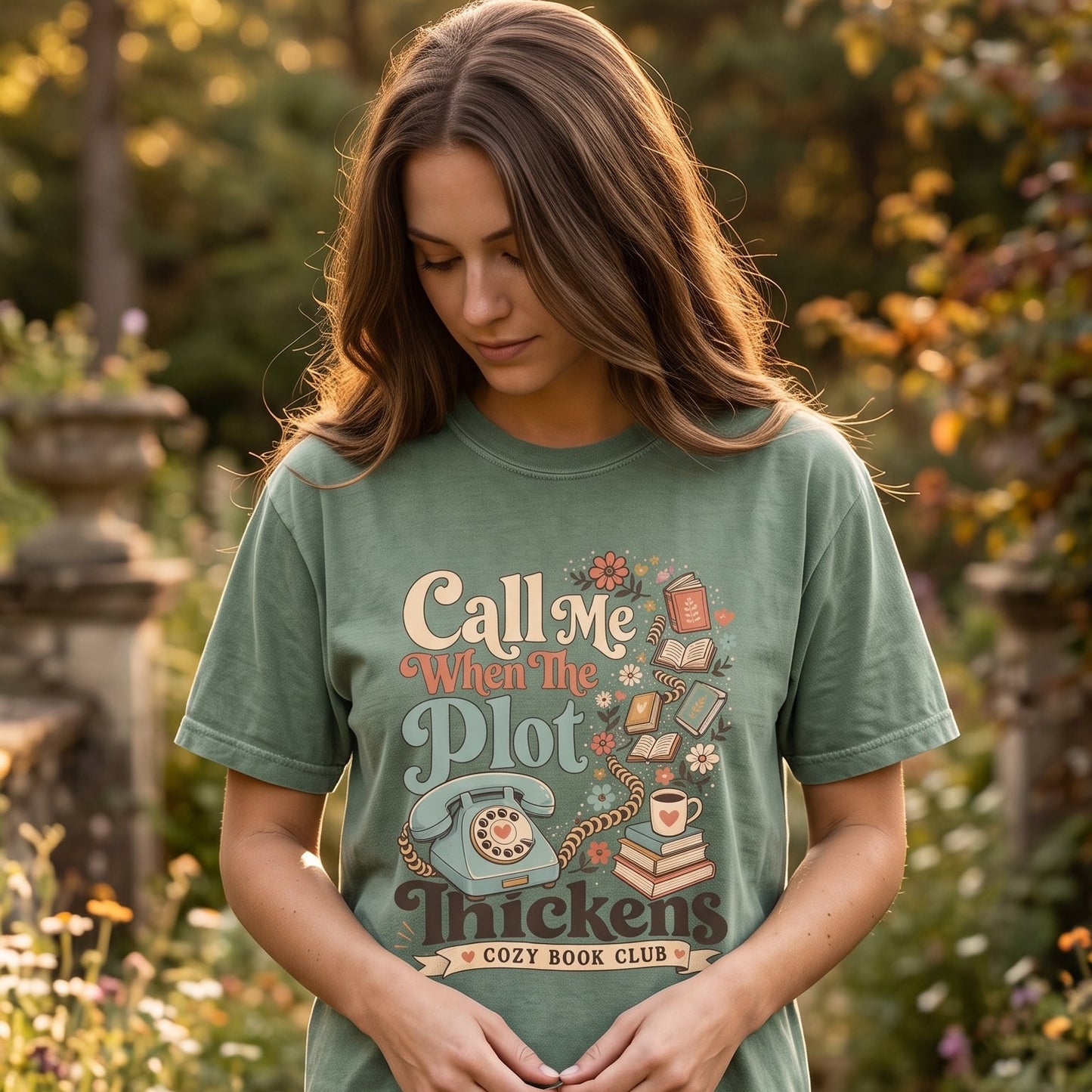 Call Me When the Plot Thickens book club T-shirt featuring a vintage rotary telephone with books, flowers and a cozy reading theme