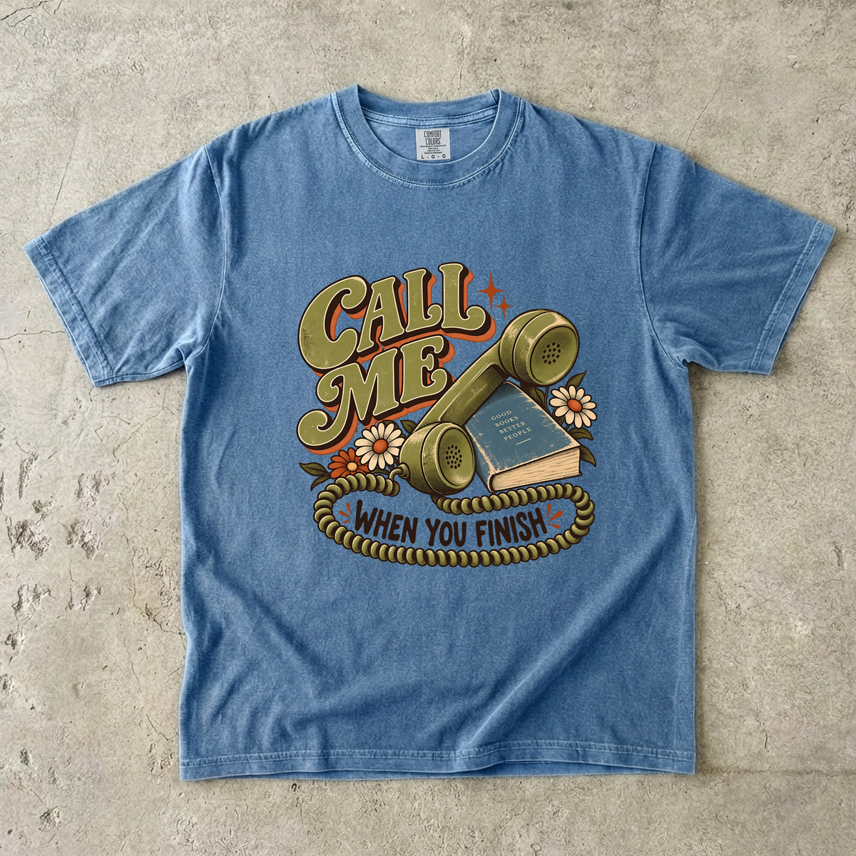 Blue Jean book lover T-shirt with “Call Me When You Finish,” a retro telephone, book and flowers