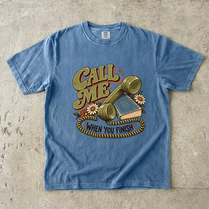 Blue Jean book lover T-shirt with “Call Me When You Finish,” a retro telephone, book and flowers