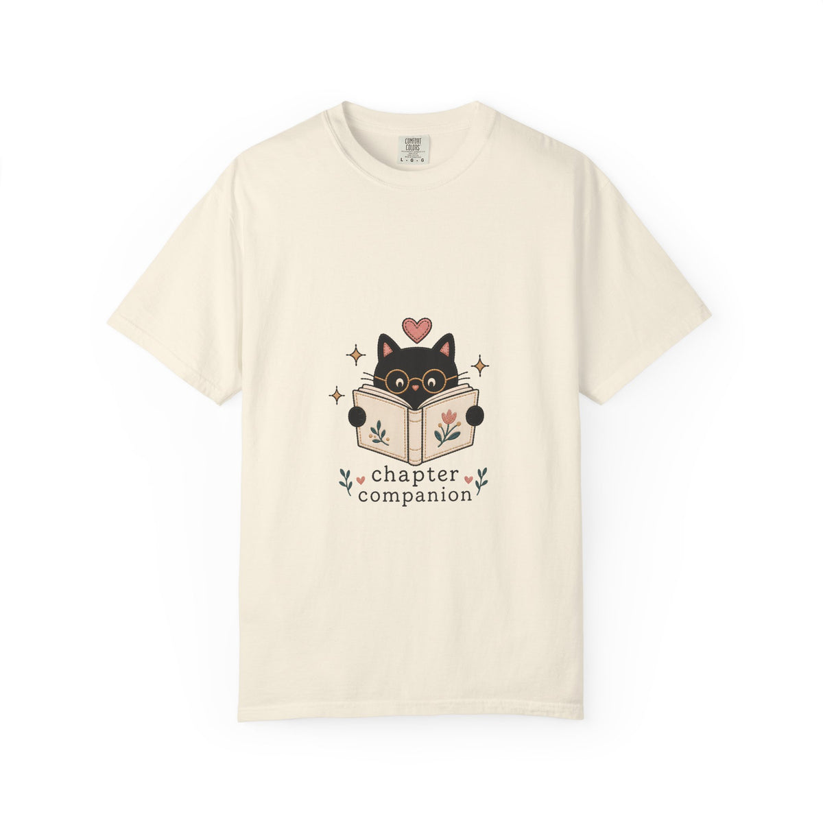 Chapter Companion cat reading shirt in Ivory featuring a black cat with glasses reading a floral book.