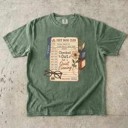 Checked Out for a Quiet Evening reading T-shirt with vintage library card, books and glasses on Moss.