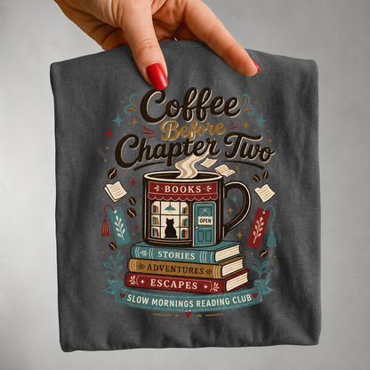 Close-up handheld view of the Coffee Before Chapter Two Pepper Comfort Colors coffee lover and book lover T-shirt displaying the detailed bookstore and coffee illustration.