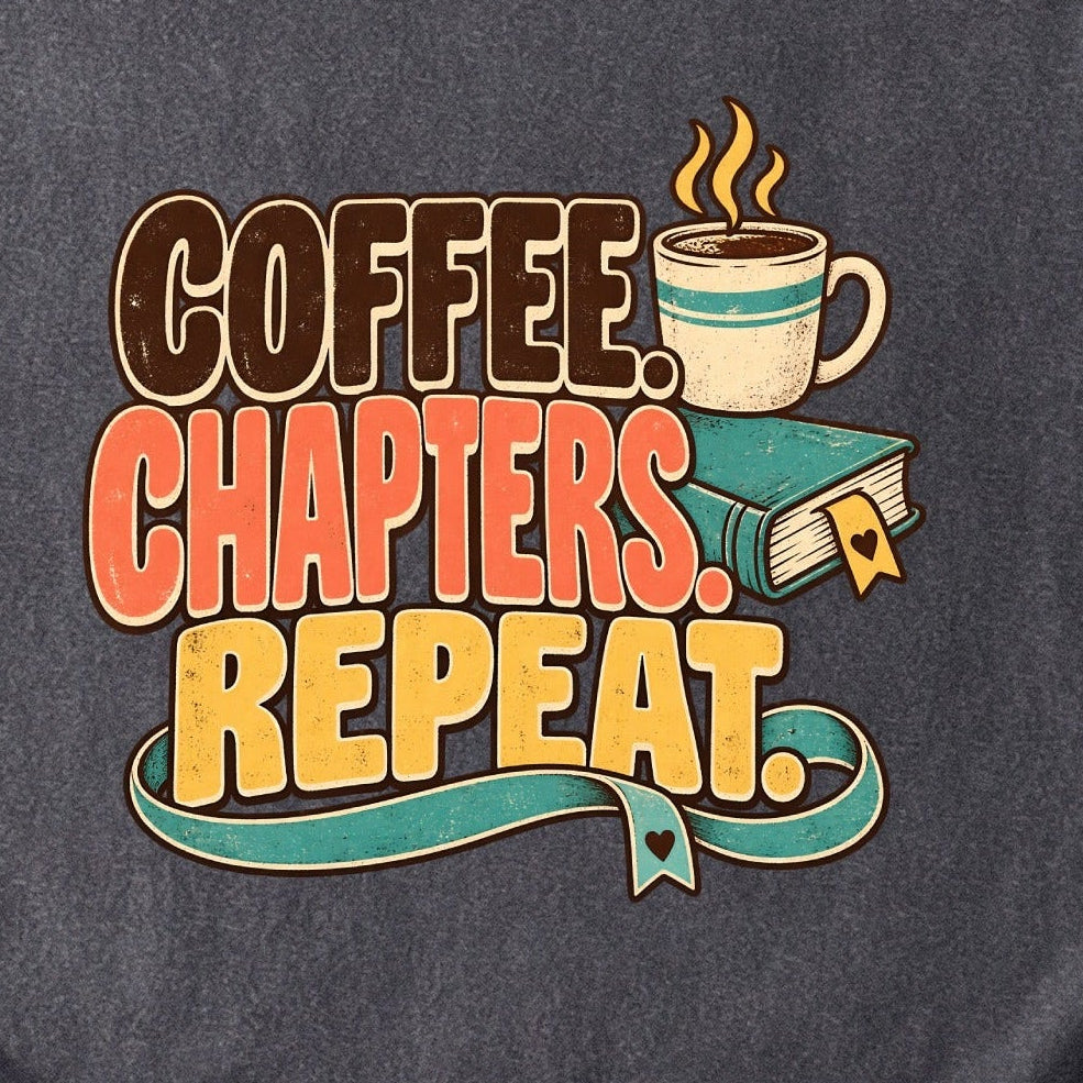 Close-up of the “Coffee. Chapters. Repeat.” T-shirt design, showing brown, coral and gold lettering, a steaming mug, a teal book and heart-shaped bookmark details.