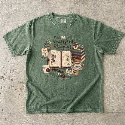 Collected in the Margins literary T-shirt with annotated open book, pressed flowers and notes on Moss.