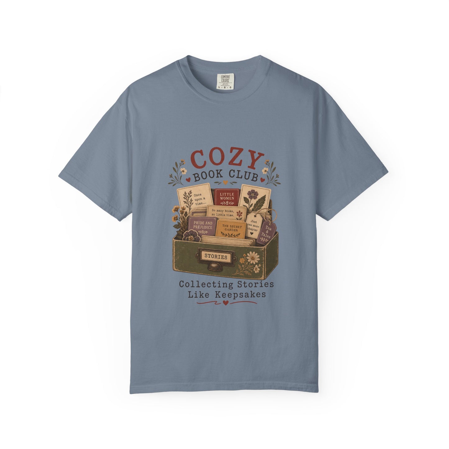 Cozy Book Club T-shirt in Blue Jean featuring a vintage story collection with classic books, flowers and reading notes