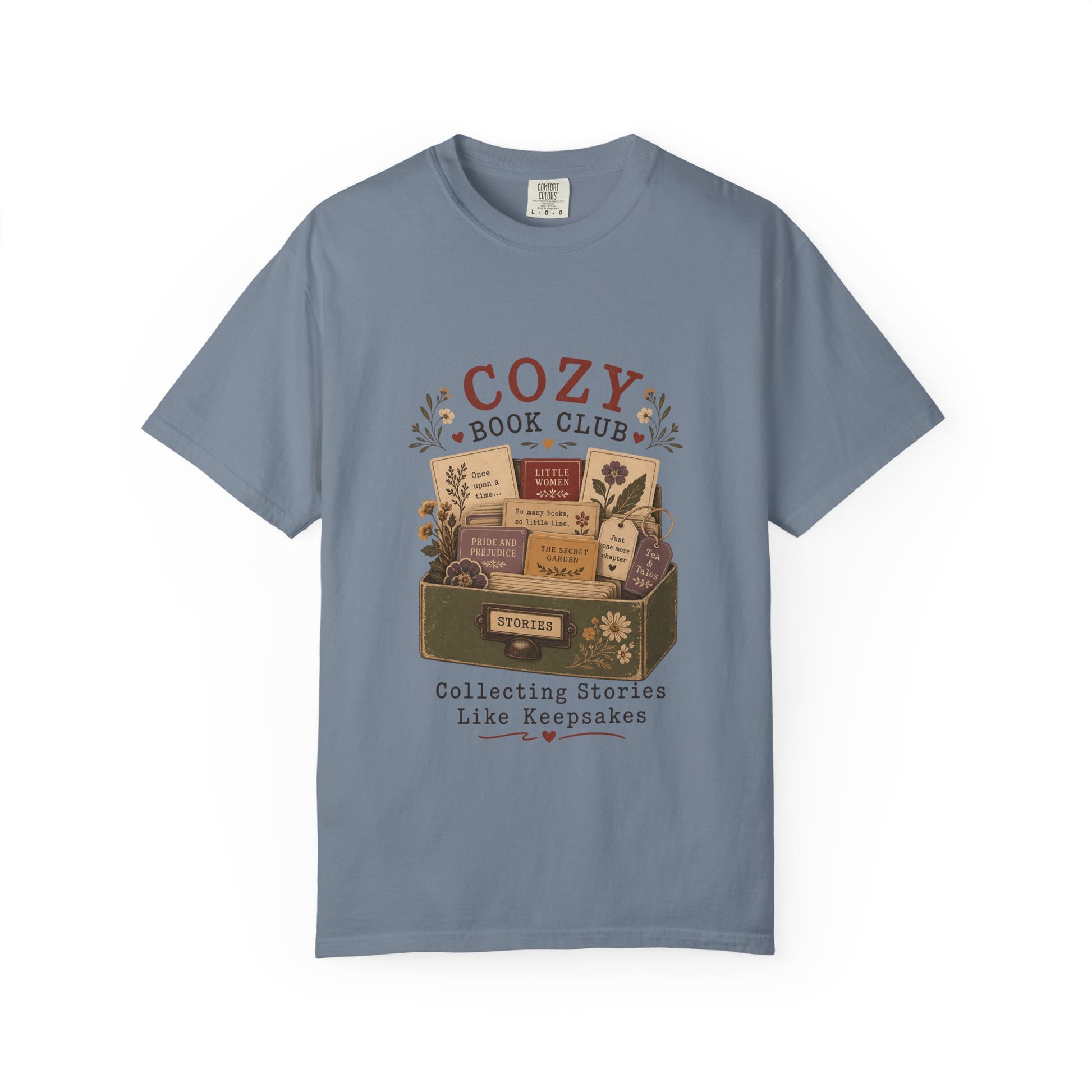 Cozy Book Club T-shirt in Blue Jean featuring a vintage story collection with classic books, flowers and reading notes