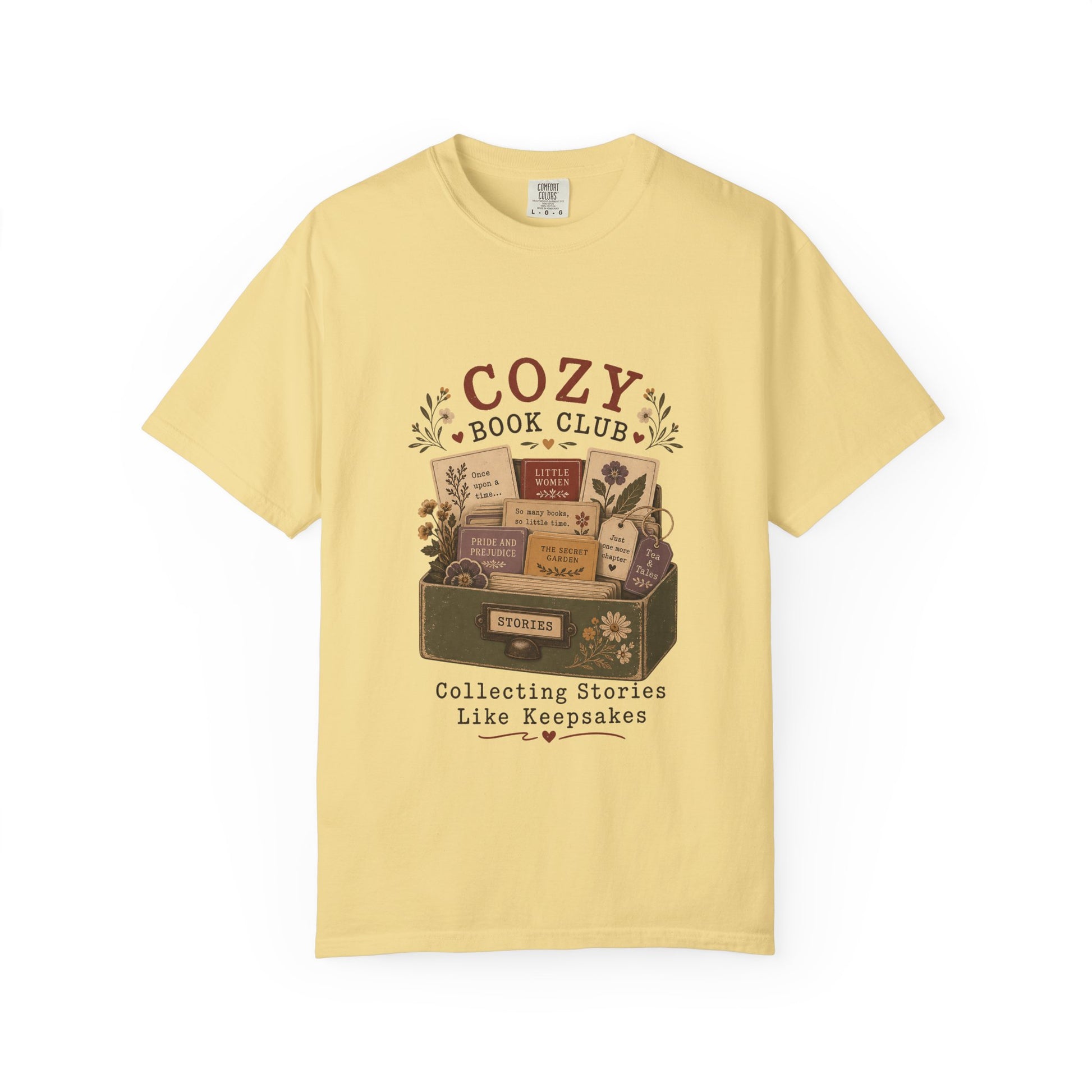 Cozy Book Club T-shirt in Butter featuring a vintage story collection with classic books, flowers and reading notes