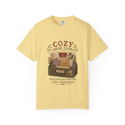 Cozy Book Club T-shirt in Butter featuring a vintage story collection with classic books, flowers and reading notes