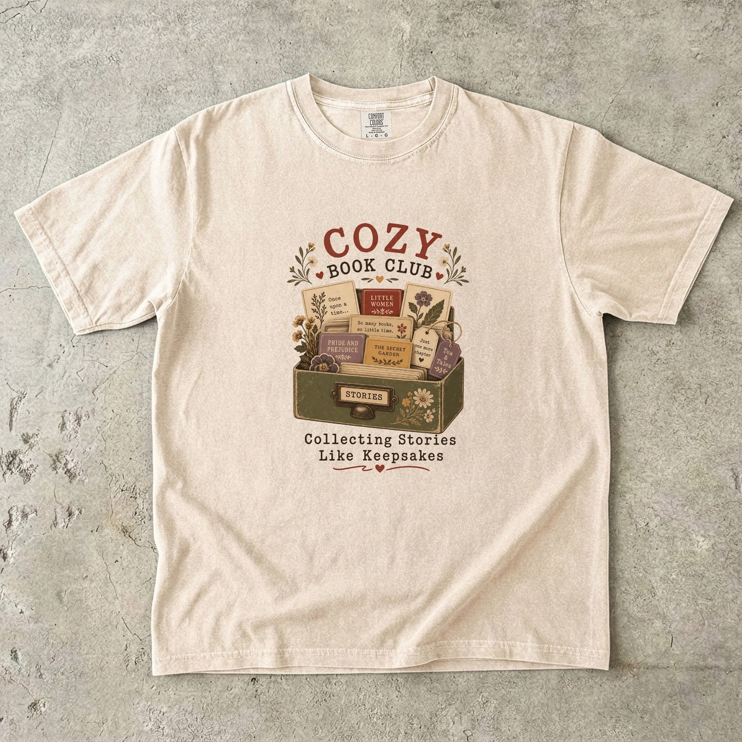 Cozy Book Club T-shirt in Ivory featuring a vintage story collection with classic books, flowers and reading notes