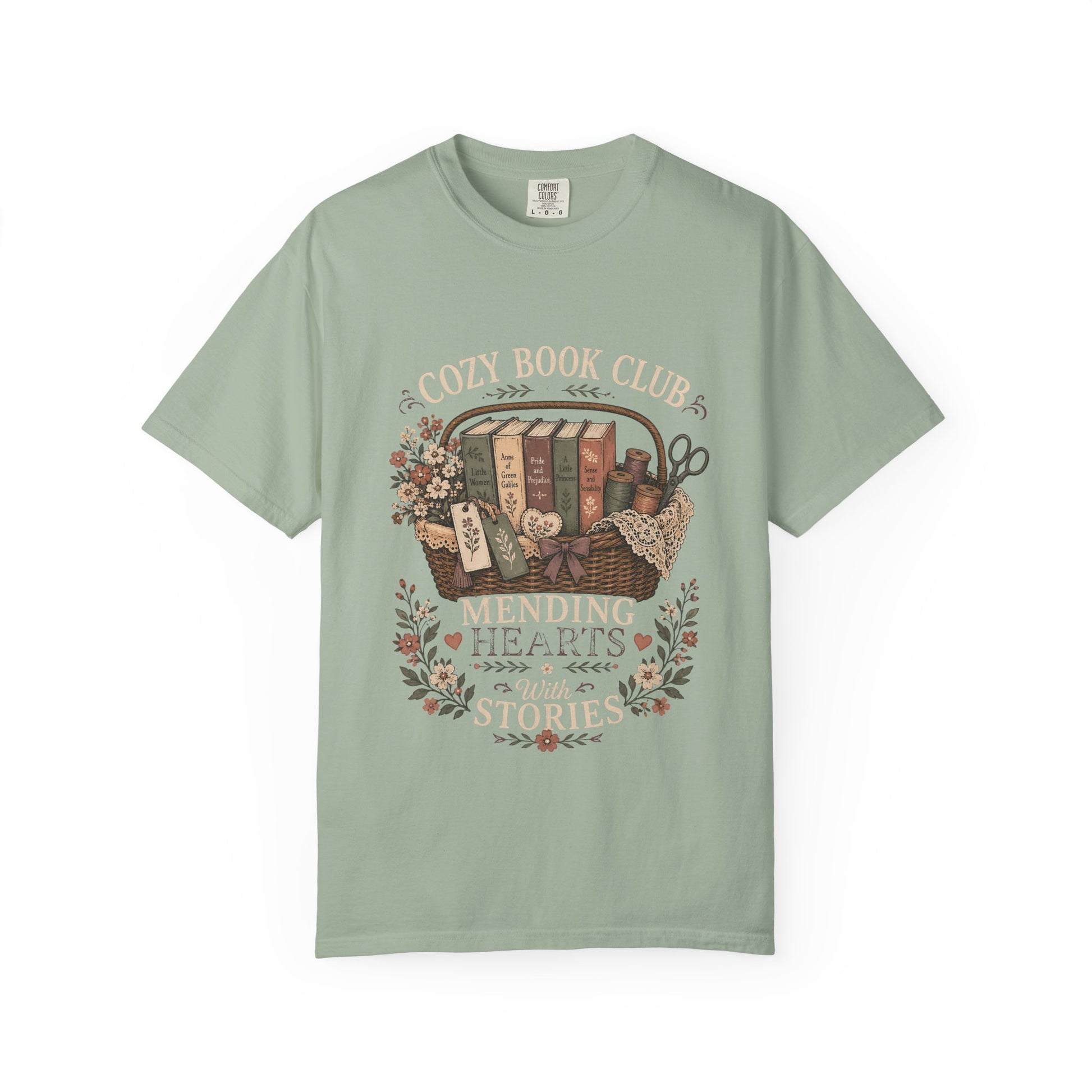 Cozy Book Club – Mending Hearts With Stories design on a Seafoam Comfort Colors 1717 garment-dyed T-shirt featuring classic books, flowers and botanical details.

