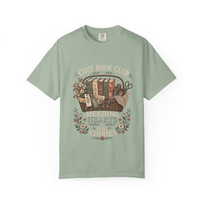 Cozy Book Club – Mending Hearts With Stories design on a Seafoam Comfort Colors 1717 garment-dyed T-shirt featuring classic books, flowers and botanical details.

