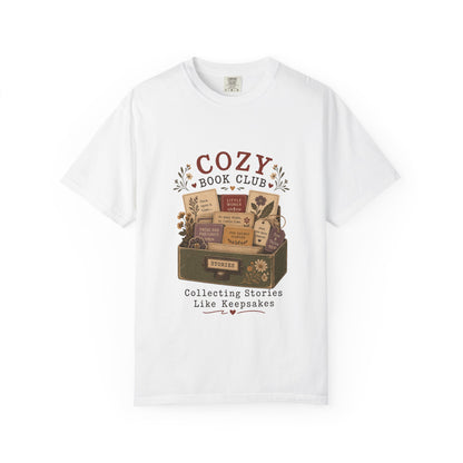 Front view of the Cozy Book Club Comfort Colors T-shirt in White featuring a vintage library drawer illustration with classic books and botanical details.