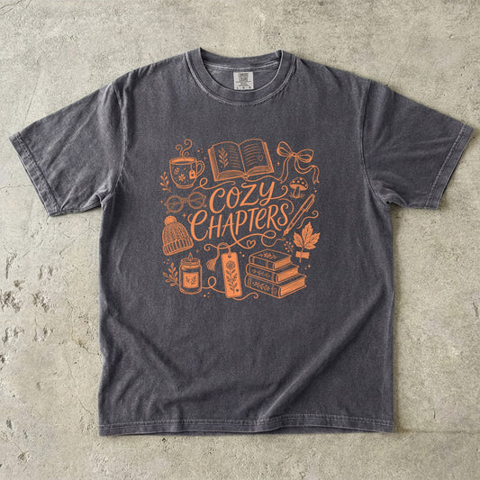 Pepper Comfort Colors book lover T-shirt featuring the Cozy Chapters design with books, tea and cozy reading details.