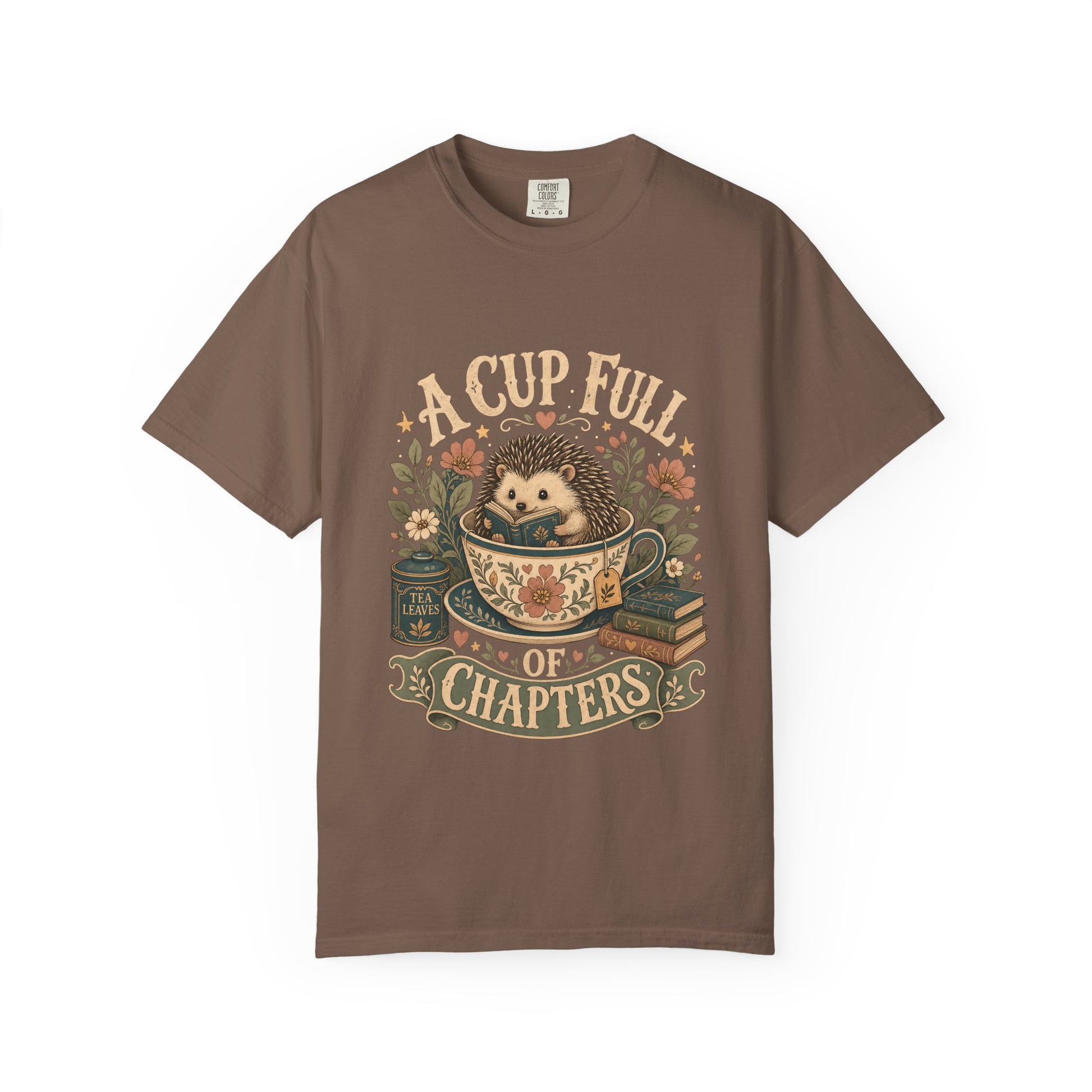A Cup Full of Chapters hedgehog reading T-shirt in Espresso featuring a hedgehog reading inside a floral teacup with books