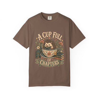 A Cup Full of Chapters hedgehog reading T-shirt in Espresso featuring a hedgehog reading inside a floral teacup with books