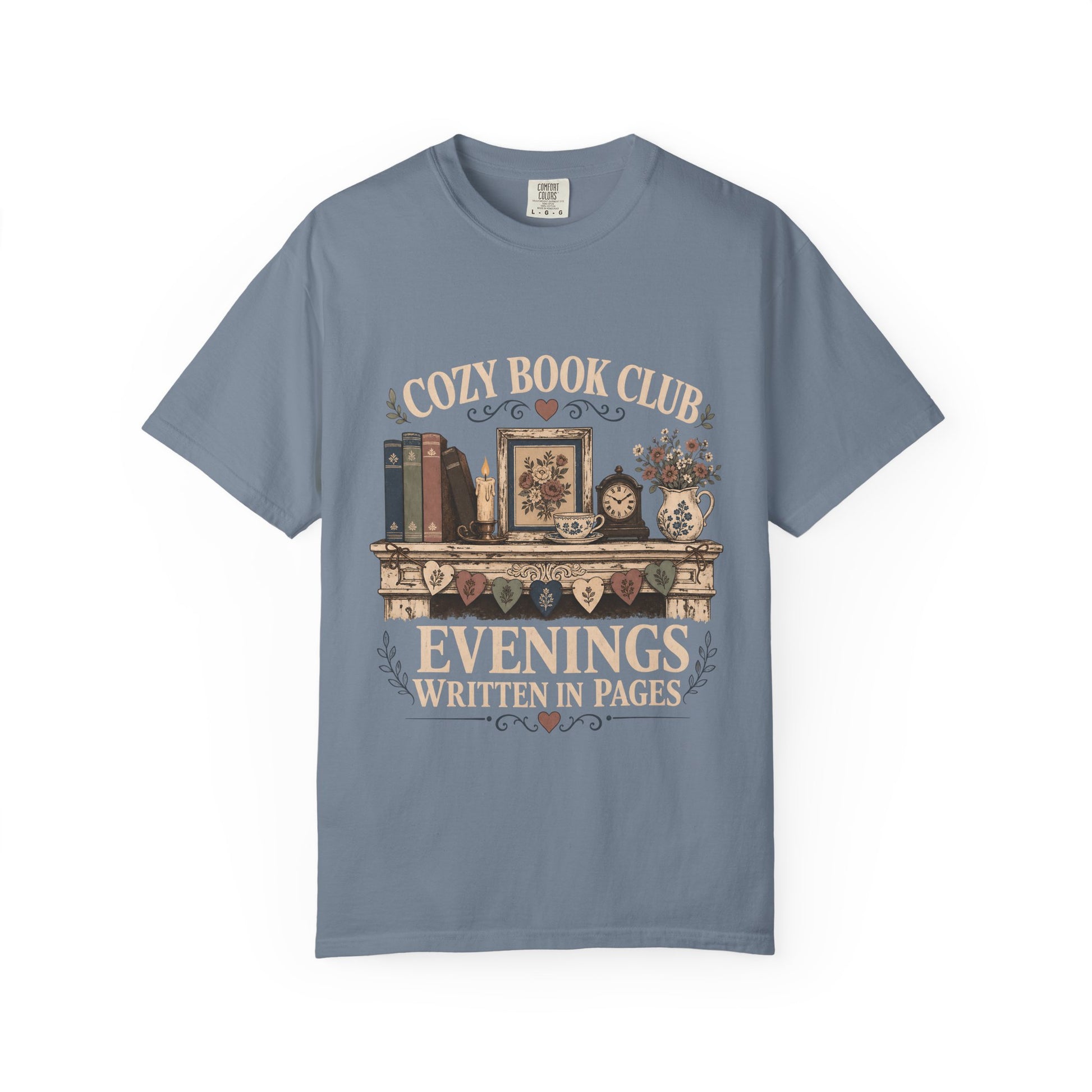Evenings Written in Pages cozy book club T-shirt in Blue Jean featuring books, a candle, floral teacup, flowers and vintage mantel