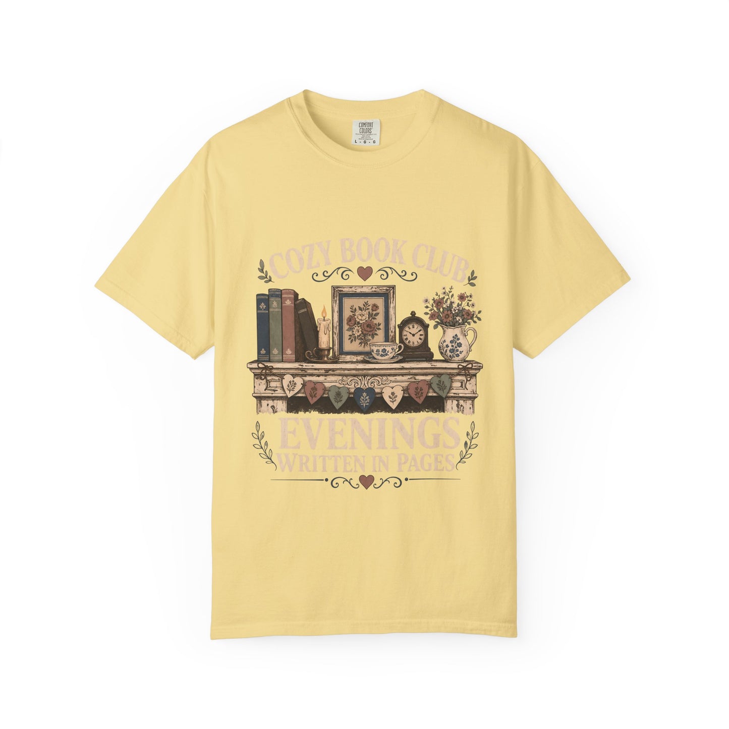Evenings Written in Pages cozy book club T-shirt in Butter featuring books, a candle, floral teacup, flowers and vintage mantel