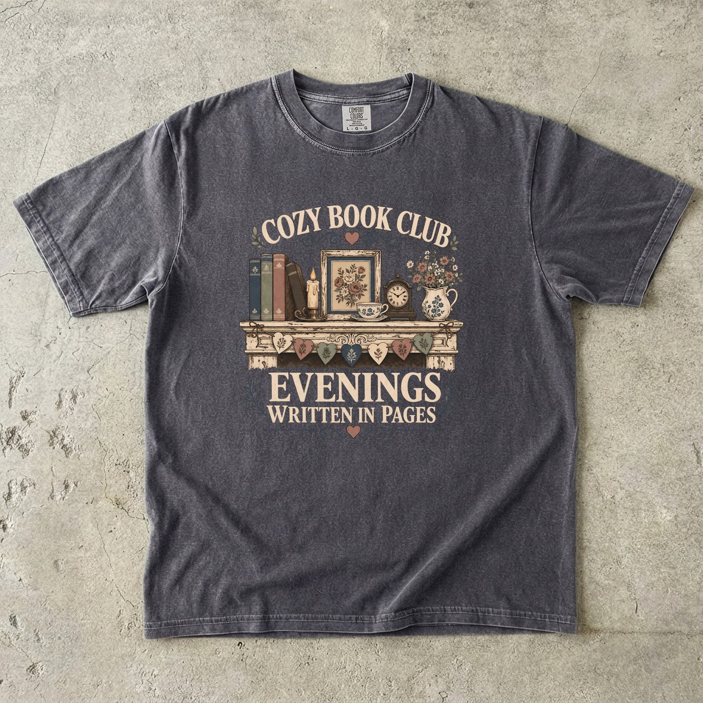 Evenings Written in Pages cozy book club T-shirt in Pepper featuring books, a candle, floral teacup, flowers and vintage mantel