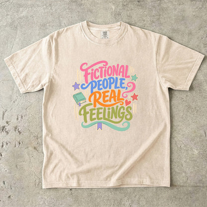 Ivory Comfort Colors reader T-shirt featuring the colourful Fictional People, Real Feelings book lover design.