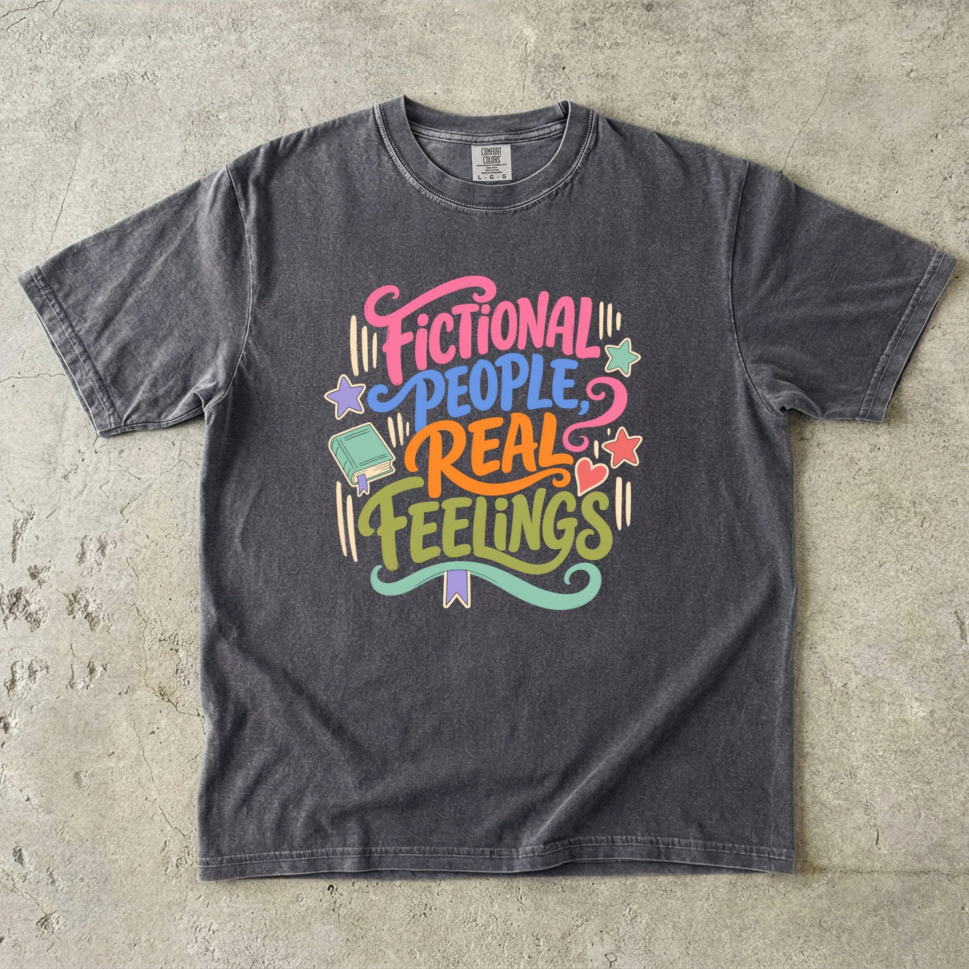Pepper Comfort Colors book lover T-shirt featuring the colourful Fictional People, Real Feelings reader design.