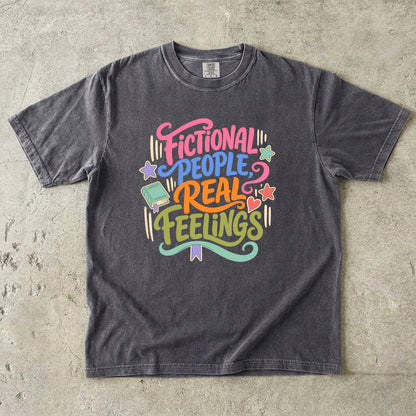Pepper Comfort Colors book lover T-shirt featuring the colourful Fictional People, Real Feelings reader design.