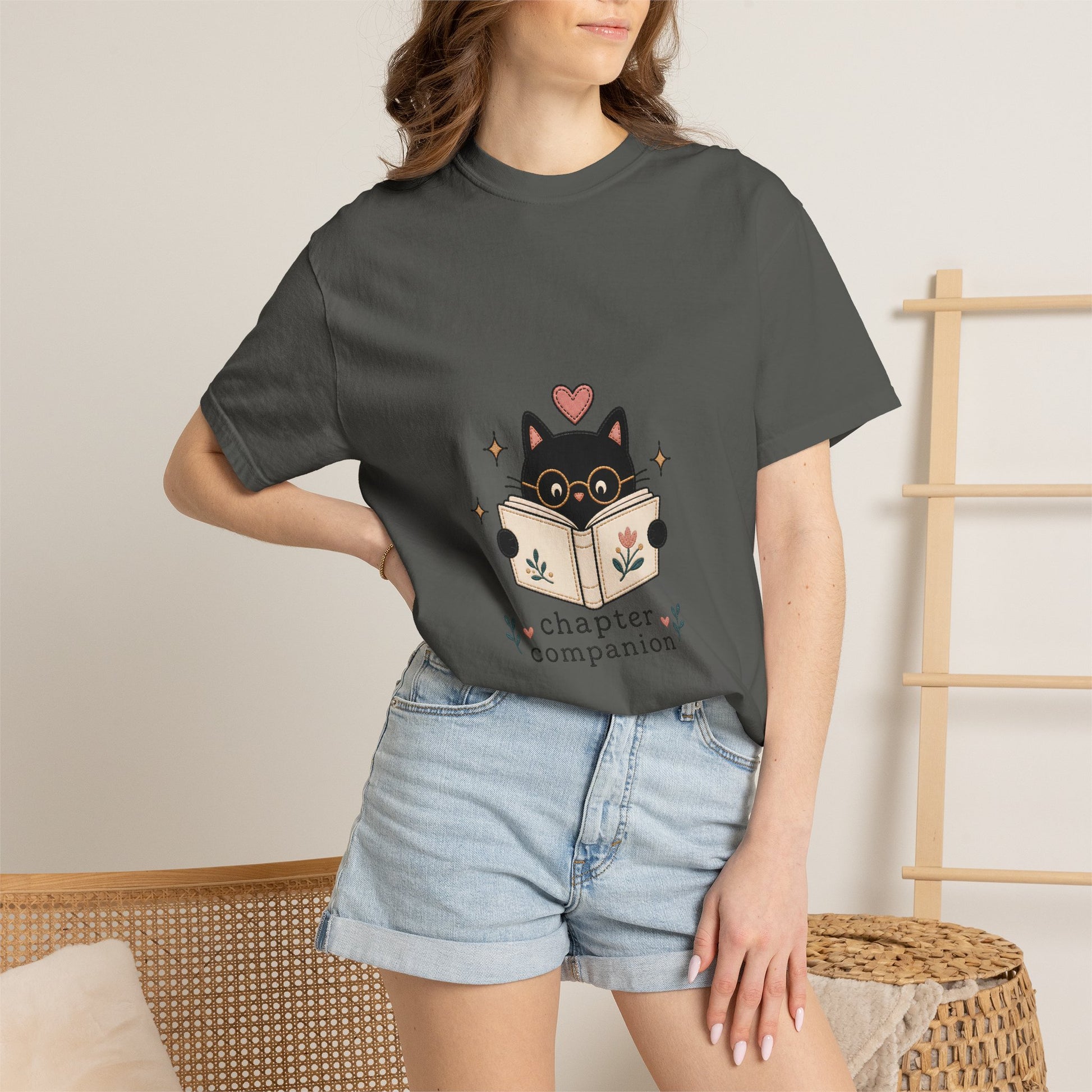 Woman wearing the pepper Chapter Companion book lover cat T-shirt by Flourish Creation Labs, inspired by books, reading and quiet moments.