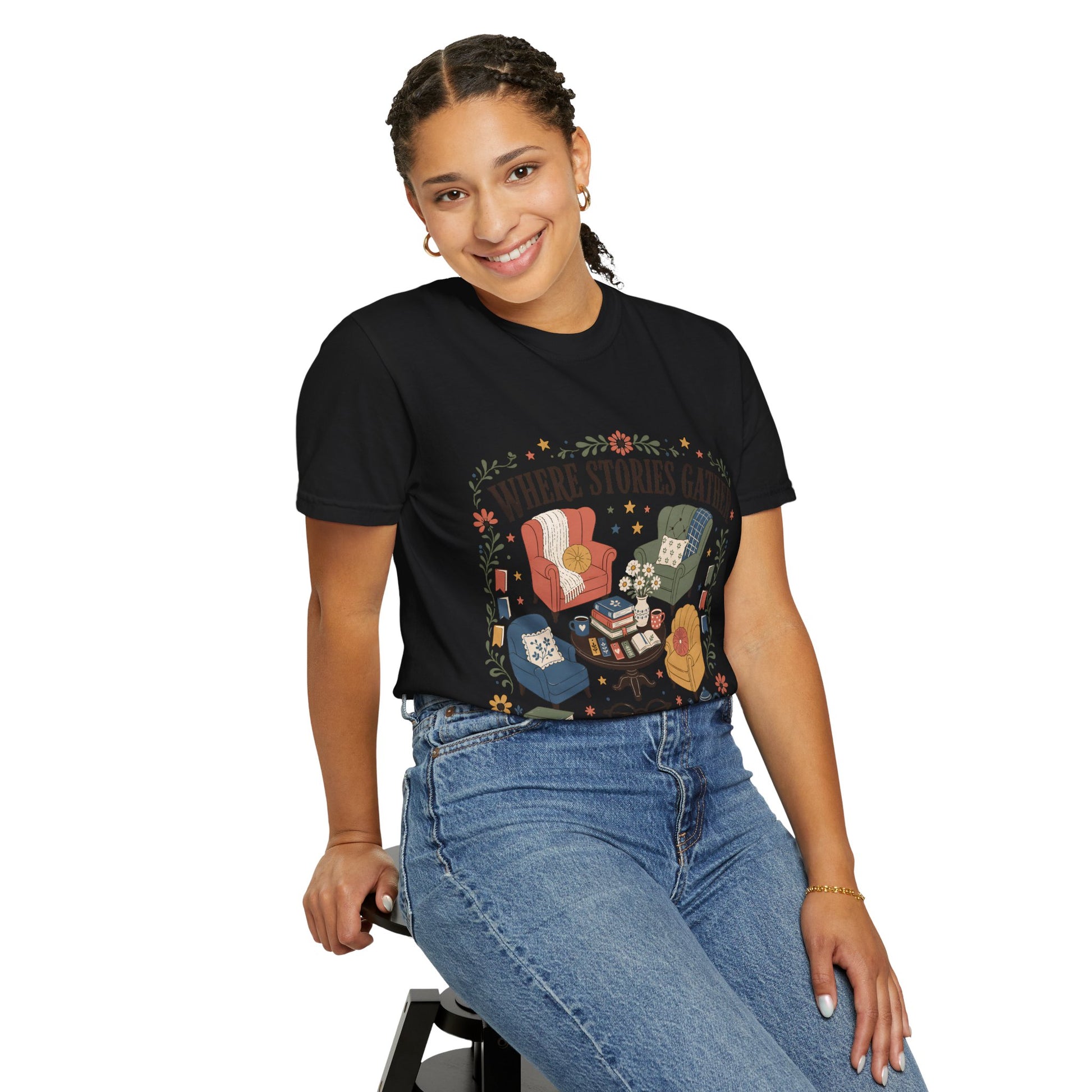 Woman wearing the black Where Stories Gather library-inspired T-shirt celebrating the places where stories bring people together.