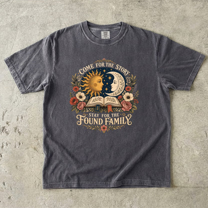 Pepper Comfort Colors found family T-shirt featuring celestial sun and moon artwork, flowers and an open book.