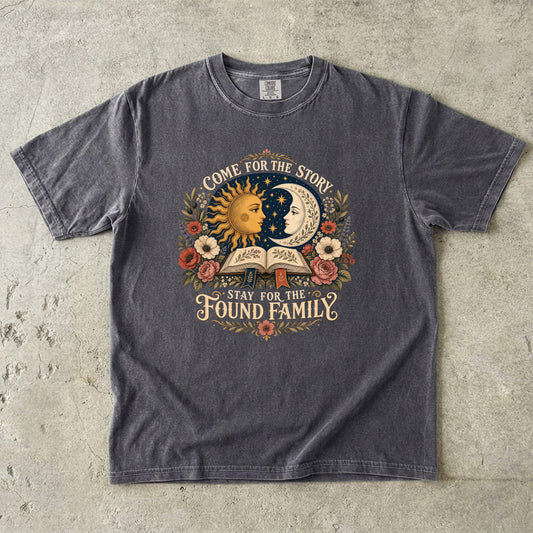 Pepper Comfort Colors found family T-shirt featuring celestial sun and moon artwork, flowers and an open book.