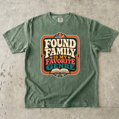 Moss Comfort Colors bookish T-shirt featuring the Found Family Is My Favorite Genre retro reader design.