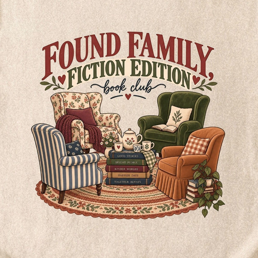 Close-up of the “Found Family, Fiction Edition” T-shirt design, showing four mismatched armchairs, books, a tea setting, cushions, a rug and leafy plants.